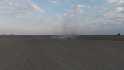 Flying Towards Tractor In A Field Stock Footage 316713678