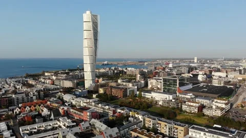 Flying towards turning torso, Malmö, Sweden, late summer evening time Stock Footage 139803618