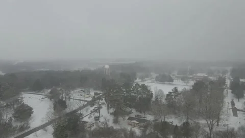 Flying towards water tower in the snow Stock Footage 148652822