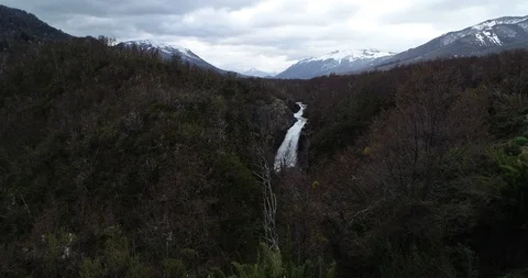 Flying towards waterfall between dense woods of native vegetation. Vullignanco 스톡 동영상 126252700