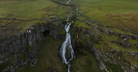 Flying towards a waterfall on a hillside Stock Footage 276092510