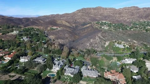 Flying towards a wildfire damaged canyon and open space. Stock Footage 100339552