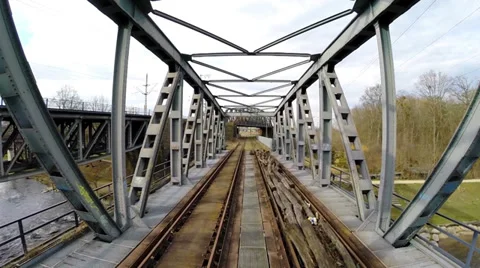 Flying trough bridge construction. aerial view. old bridge. rail road tracks Stock Footage 36193377