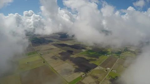 Flying trough clouds toward farm land agriculture northern Ca. Stock Footage 240414870