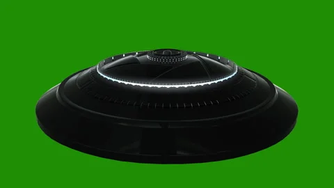 Flying UFO on green background Loop video Stock Footage 256609964