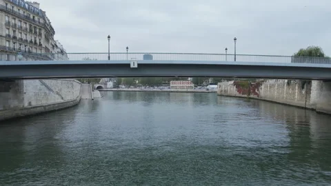 Flying under a bridge along the River Seine in Paris France Stock Footage 244854459