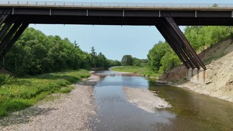 Flying under a Bridge: Jacquet River Stock Footage 339803804