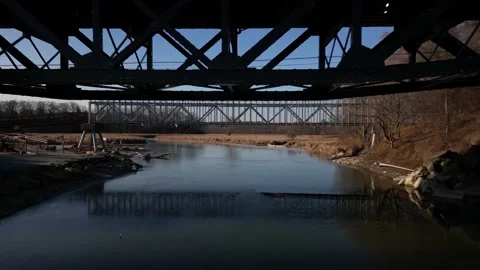 Flying under a bridge at Rouge Beach in Scarborogh Ontario. Stock Footage 228445172