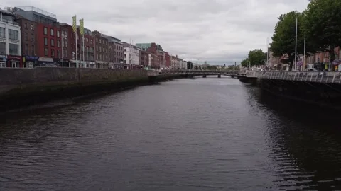 Flying Under the Halfpenny Bridge on the River Liffey Stock Footage 234516763