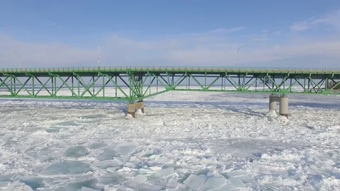 Flying Under the Mackinaw Bridge in Winter Stock Footage 81801824