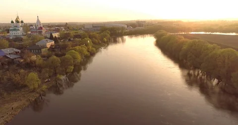 Flying under river and bridge. aerial view. sunset panorama. crossing bridge Video stock 75418319