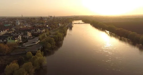 Flying under river and bridge. aerial view. sunset panorama. crossing bridge Video stock 75418849
