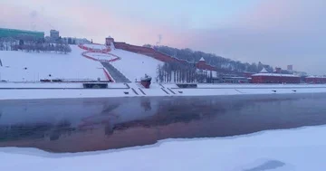 Flying under the river, walls and towers of the Nizhny Novgorod Kremlin. Dawn ov Stock Footage 85700657