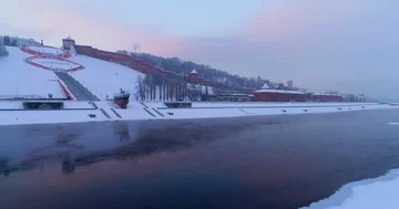 Flying under the river, walls and towers of the Nizhny Novgorod Kremlin. Dawn ov Stock Footage 85700855