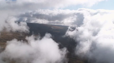 Flying upslope on Mauna Loa through clouds. Shot in 2010. Stock Footage 59375716