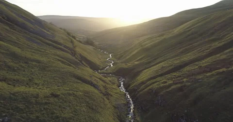 Flying in the valley at sunrise Stock Footage 132765805