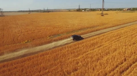 Flying vertically above car driving on road 库存影片 61147829