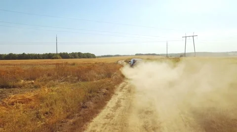 Flying vertically above car driving on road 库存影片 61148014