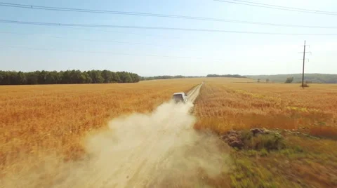 Flying vertically above car driving on road 库存影片 61148468