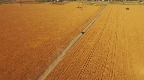 Flying vertically above car driving on road 库存影片 61148986