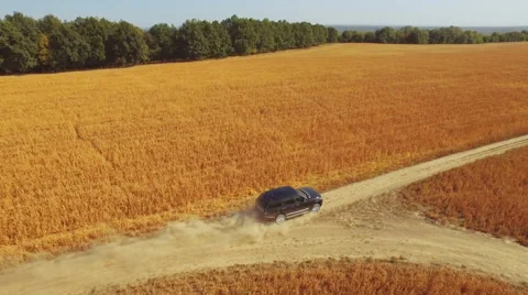 Flying vertically above car driving on road. 库存影片 61149113