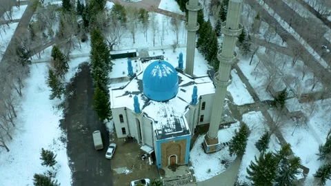 Flying vertically down on a drone over a mosque with blue dome, winter Kazakhsta Stock Footage 240530906