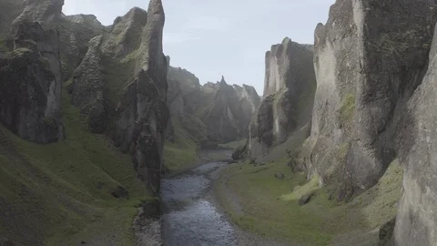 Flying VERY LOW and directly through the Fjadrargljufur Canyon Stock Footage 125242517
