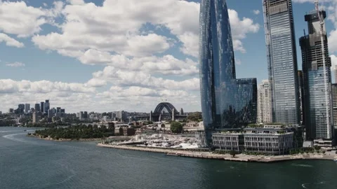 Flying view Barangaroo foreground &amp; Sydney Harbour Bridge - Drone Aerial Stock Footage 235301187