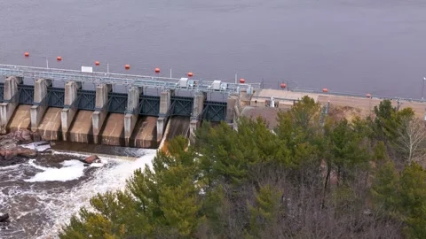 Flying view with pine trees at Jim Falls dam Stock Footage 305774295