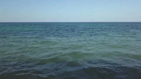 Flying view of two boys with their backs to the sea in Mallorca Stock Footage 221724296