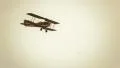 Flying vintage combat biplane in air HD Footage