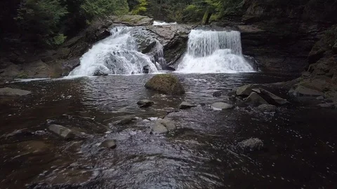 Flying up a waterfall in the woods Stock Footage 100127072