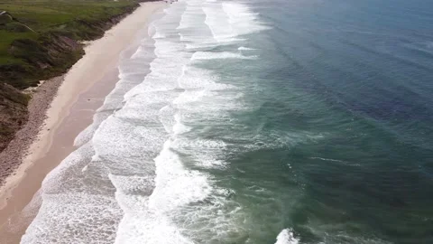 Flying to West along coast on empty beach in playa de Gerra, Cantabria, Spain 4K Stock Footage 155592451