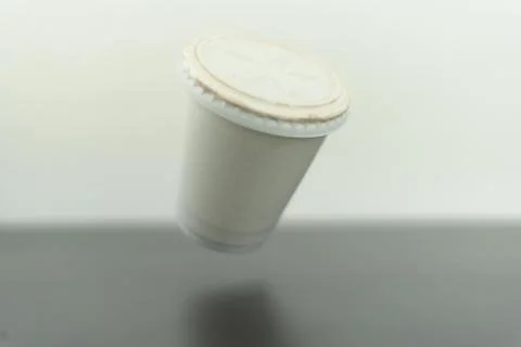 Flying white cafe cup Stock Photos