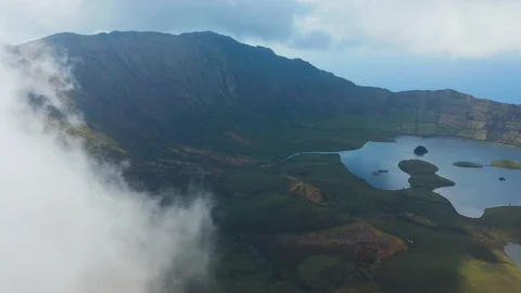 Flying in white clouds above huge caldera of inactive volcano of Corvo island Vidéo 117769458