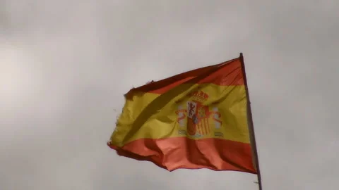Flying in the wind the Spain flag on the background of the sky. Stock Footage 92570933