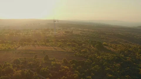 Flying to Wind turbines generating renewable, sustainable energy in mountains Stock Footage 115989190