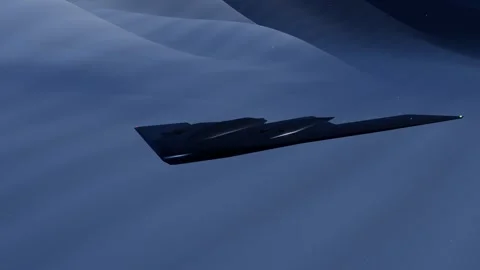 Flying wing stealth bomber on a night mountain penetration mission under 動画素材 340876917