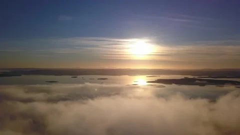 Flying on a winter day in the sun above low clouds Stock Footage 143552050