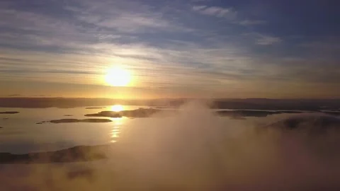 Flying on a winter day in the sun above low clouds Stock Footage 143681114