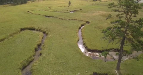 FlyingIntoRiver'sMeander.Sun reflection in water Stockbeeldmateriaal 235707288