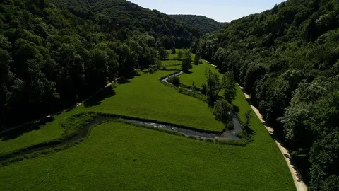 Flyover above beautiful small River on the Countryside Stock Footage 112035376