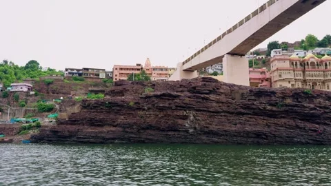 Flyover above lake surrounded by lush greenery Stock Footage 295925976