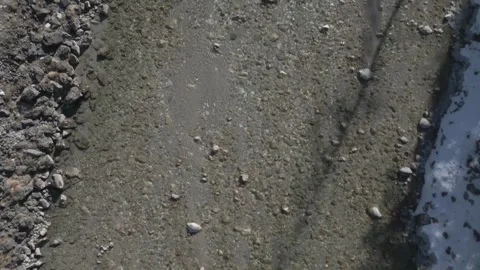 A flyover of an alpine river, captured in D-Log for flexible post-production Stock Footage 301605414
