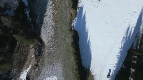 A flyover of an alpine river, captured in D-Log for flexible post-production Stock Footage 301605697