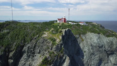 A flyover approach of the Long Point Lighthouse at Crow Head Stock Footage 228682226