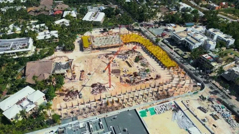 Flyover around the construction site in Bavaro, Punta Cana Stock Footage 306691243