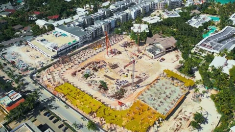 Flyover around the construction site in Bavaro, Punta Cana Video stock 306691365