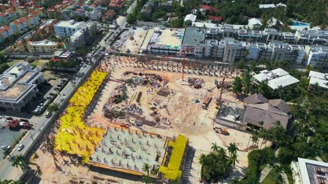 Flyover around the construction site in Bavaro, Punta Cana Stock Footage 306691396