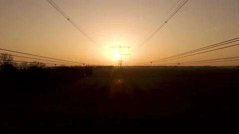 Flyover between Electric cables towards High voltage electric tower during Stock Footage 195293051